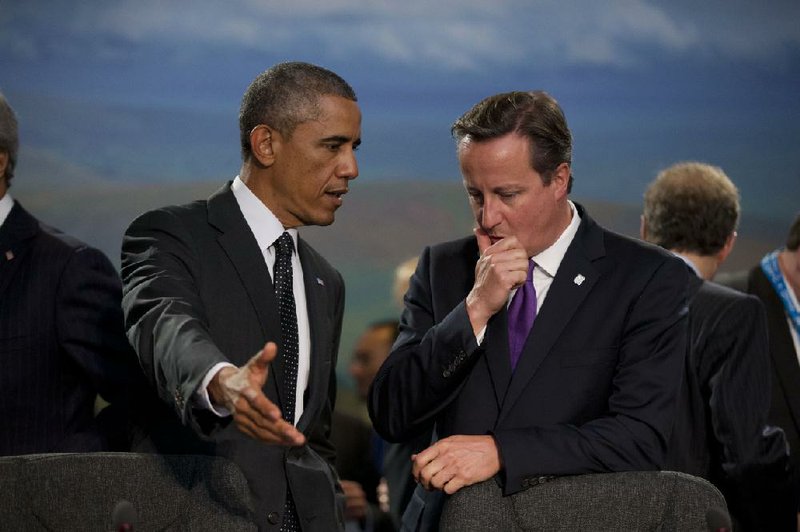 President Barack Obama and British Prime Minister David Cameron confer at a session Thursday in Newport, Wales, on NATO’s role in Afghanistan.