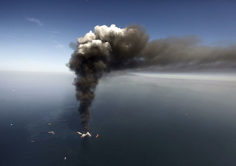 Oil oozes around the burning BP Deepwater Horizon drilling rig on April 21, 2010. A judge found Thursday that the oil company acted with gross negligence in the rig explosion and oil spill.