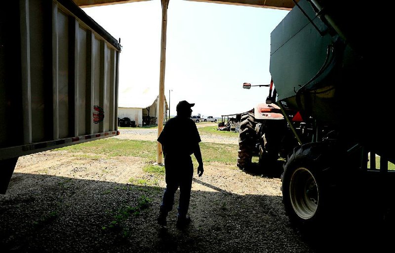 Arkansas Democrat-Gazette/RICK MCFARLAND--08/27/14--  John Carroll, one of the owners of Jimel Farms in Brinkley in one of their equipment barns.