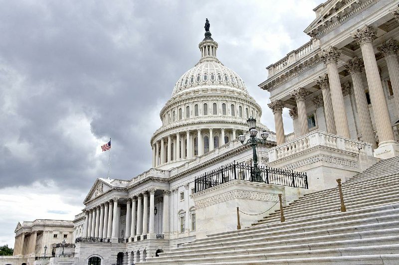 This photo taken July 23, 2013, show the U.S. Capitol in Washington. Congress returns to work this week with a relatively short and simple agenda, vote to keep the government operating in the short term, then return home to campaign. National security threats from Islamic State militants and Russian aggression in Ukraine loom large, but September's session may be too short for lawmakers to do anything but talk about them.  (AP Photo/J. Scott Applewhite)