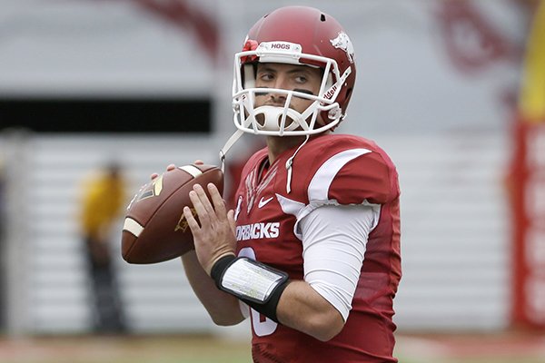 Arkansas quarterback Brandon Allen warms up before the first quarter of an NCAA college football game in Fayetteville, Ark., Saturday, Sept. 6, 2014. (AP Photo/Danny Johnston)