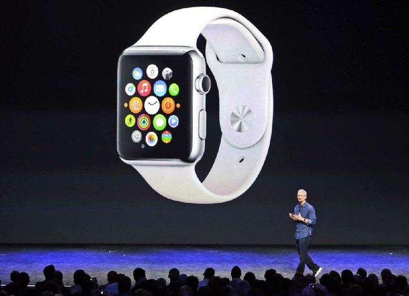 Apple Chief Executive Officer Tim Cook introduces the new Apple Watch on Tuesday in Cupertino, Calif.