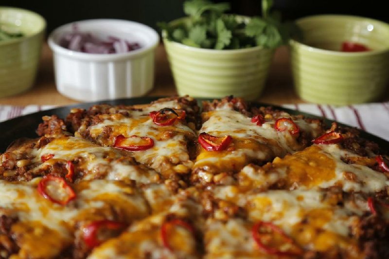 Taco Pizza can be customized with each diner’s preferred toppings and takes about 30 minutes to prepare.