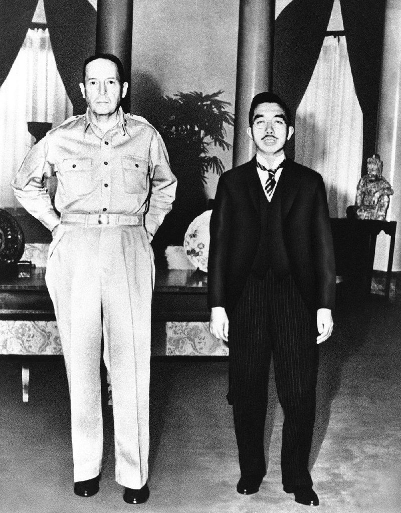 Gen. Douglas MacArthur stands with Japanese Emperor Hirohito during their first meeting on Sept. 27, 1945, at the U.S. Embassy in Tokyo. MacArthur made the decision not to try Hirohito as a war criminal.