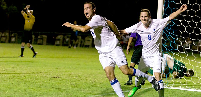 Courtesy of JBU Sports Information John Brown freshman Douglas Oliveira, left, and Ryan Duncan celebrate after Oliveira scored on a header off a corner kick in the 63rd minute on Monday against the University of Ozarks. The goal helped JBU (1-3) to it&#8217;s first win of the season.
