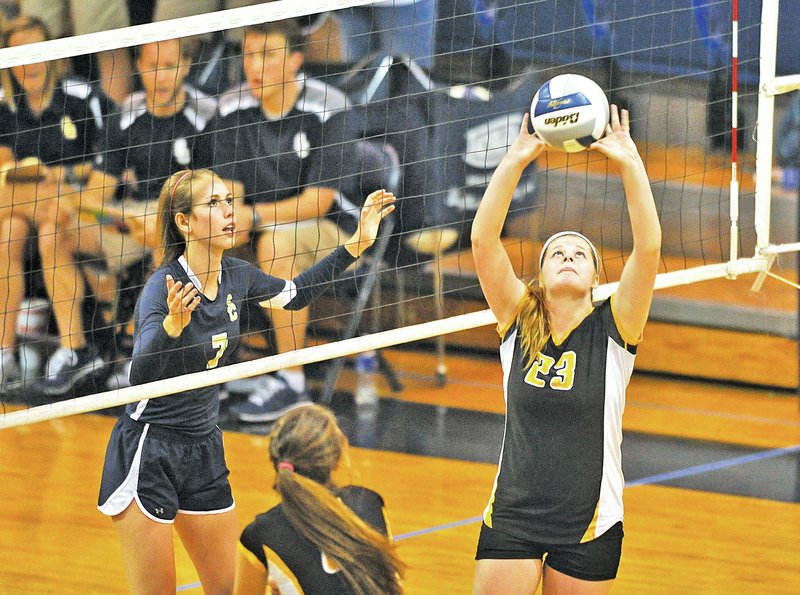  Staff Photo Michael Woods Taylor Spinks of Prairie Groves sets the ball in front of Shiloh Christian&#8217;s Reagan Robinson during Tuesday&#8217;s game against Prairie Grove at Shiloh Christian in Springdale.