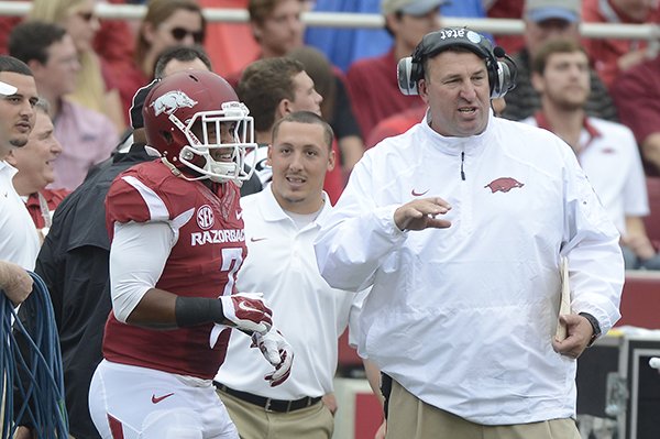 Bret Bielema, Arkansas head coach talks to Tiquention Coleman against Nicholls State in the first quarter Saturday, Sept. 6, 2014 at Razorback Stadium in Fayetteville.