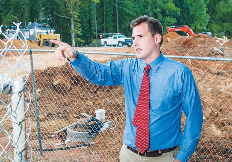 Jon Vestal, assistant vice president of institutional advancement at Lyon College in Batesville, points out the construction that is underway to expand student housing and to build a new football field house.