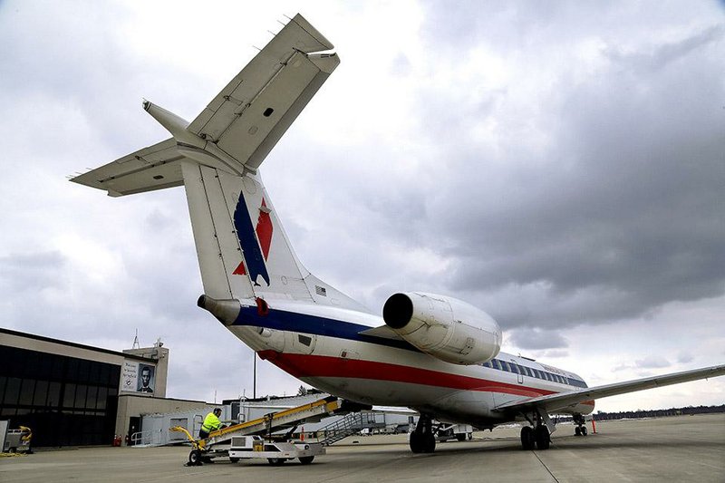 Baggage handlers unload an American Eagle jet after it landed at Abraham Lincoln Capital Airport in Springfield, Ill., in March. The regional airline industry may soon face the kind of consolidation that thinned out the larger airlines between 2008 and the end of 2013.