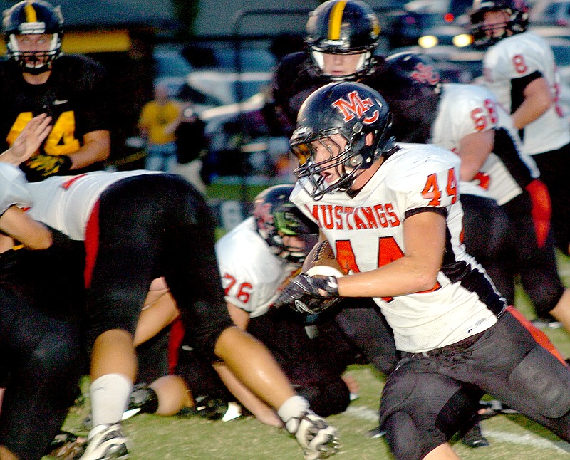 RICK PECK MCDONALD COUNTY PRESS McDonald County running back Jarrett Sanny turns the corner for a nice gain during the Mustangs 35-0 loss Friday night at Cassville. Sanny finished with 67 yards on 12 carries.