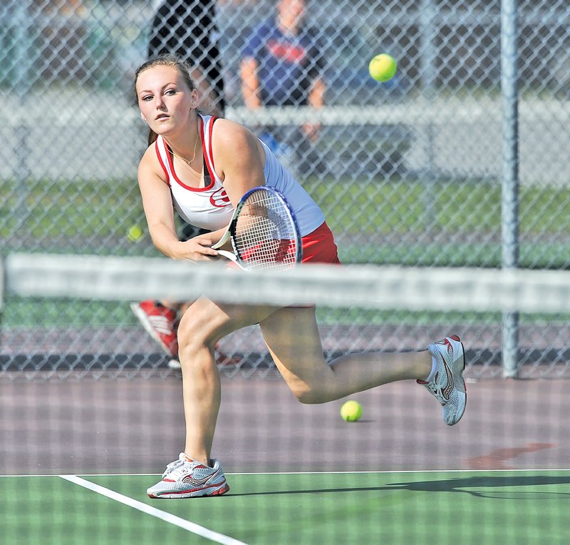  Staff Photo Michael Woods &#8226; @NWAMICHAELW Caity Townsend, Springdale tennis player, returns the ball during a doubles match Monday afternoon at Springdale High.