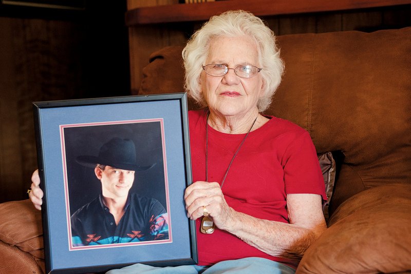 Mary Conner of Augusta holds a photo of her son, Sidney, who committed suicide.