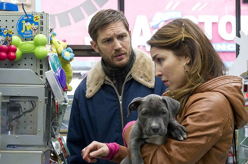 Tom Hardy as “Bob” and Noomi Rapace as “Nadia” in THE DROP. 

Photo by Barry Wetcher. 

Copyright © 2014 Twentieth Century Fox.
