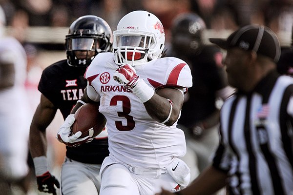 Arkansas running back Alex Collins breaks away for a touchdown in the fourth quarter of the game against Texas Tech at Jones AT&T Stadium in Lubbock, Texas on Saturday, Sept. 13, 2014. 