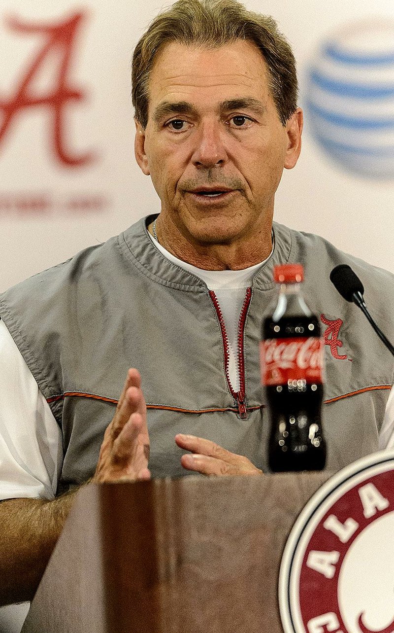 Alabama football coach Nick Saban talks with members of the media on Wednesday, Aug. 27, 2014, in Tuscaloosa, Ala. (AP Photo/AL.com, Vasha Hunt)