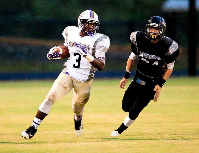 Central Arkansas Christian running back Braylon Harris runs past a Pulaski Robinson defender during Friday’s game. Harris carried 25 times for 192 yards in his team’s 28-21 loss