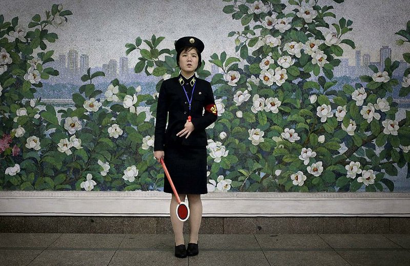 A subway station worker waits for the arrival of a train in the North Korean capital, Pyongyang. While tourism is on the rise in the repressive communist country, many sites remain off-limits to foreign visitors.