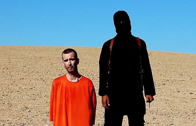 This image from a video posted on the Internet by Islamic State militants and provided by the SITE Intelligence Group reportedly shows British aid worker David Haines just before he was beheaded. Haines, 44, was abducted in Syria in 2013.