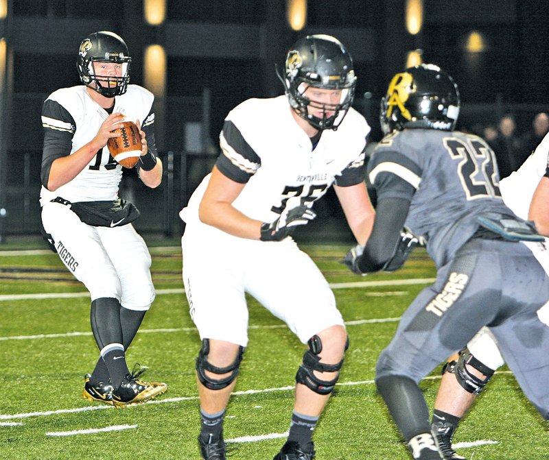  Special To NWA Media Joel Rafkin Kasey Ford, Bentonville quarterback, drops back for a pass while teammate Hunter Hastings blocks Broken Arrow&#8217;s Eric Clark during Friday&#8217;s game at Broken Arrow, Okla.