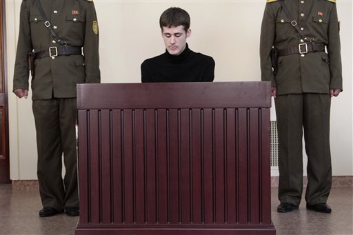 Matthew Miller, a U.S. citizen, sits before the Supreme Court during his trial in Pyongyang, North Korea, Sunday, Sept. 14, 2014. North Korea's Supreme Court on Sunday sentenced Miller to six years of hard labor for entering the country illegally and trying to commit espionage. 