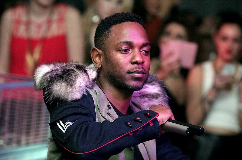 FILE - Recording artist Kendrick Lamar performs at the Maxim Magazine Super Bowl Party in this Saturday, Feb. 1, 2014 file photo taken in New York. Lamar said Saturday night Sept. 13, 2014 he was grateful to hear about Swift knowing the words to his lyrics and putting her in a great mood.  (Photo by Andy Kropa/Invision/AP, File)