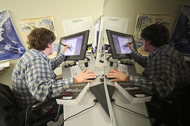 An SAU Computer Game and Animation Design students sketches digital characters for one of his new game ideas. 