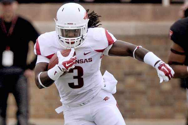 Arkansas running back Alex Collins carries the ball in the first quarter of the game against Texas Tech at Jones AT&T Stadium in Lubbock, Texas, on Saturday, Sept. 13, 2014. 