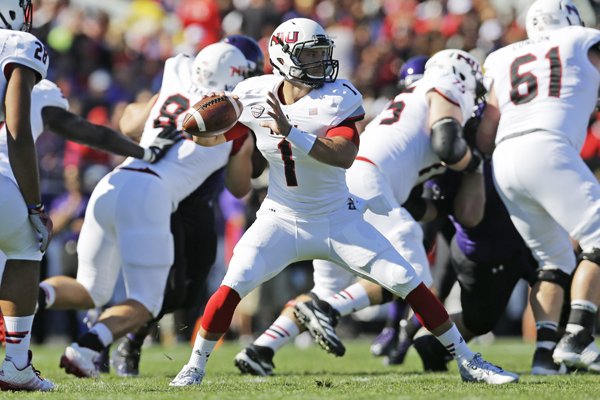 Northern Illinois quarterback Anthony Maddie (1) looks to a pass against Northwestern during the first half of an NCAA college football game in Evanston, Ill., Saturday, Sept. 6, 2014. (AP Photo/Nam Y. Huh)