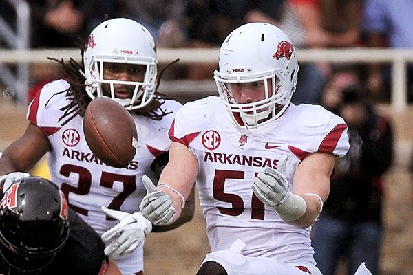 Arkansas linebacker Brooks Ellis (51) breaks up a pass during the second quarter a game against Texas Tech at Jones AT&T Stadium in Lubbock, Texas on Saturday Sept. 13, 2014. 