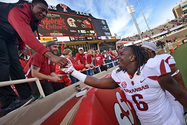 Arkansas defensive end JaMichael Winston greets fans after Arkansas defeated Texas Tech at Jones AT&T Stadium in Lubbock, Texas on Saturday, Sept. 13, 2014. 