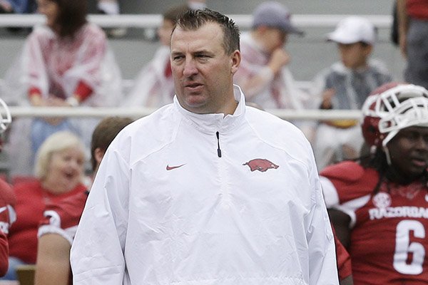 Arkansas coach Bret Bielema watches warmups before the first quarter of an NCAA college football game against Nicholls in Fayetteville, Ark., Saturday, Sept. 6, 2014. (AP Photo/Danny Johnston)