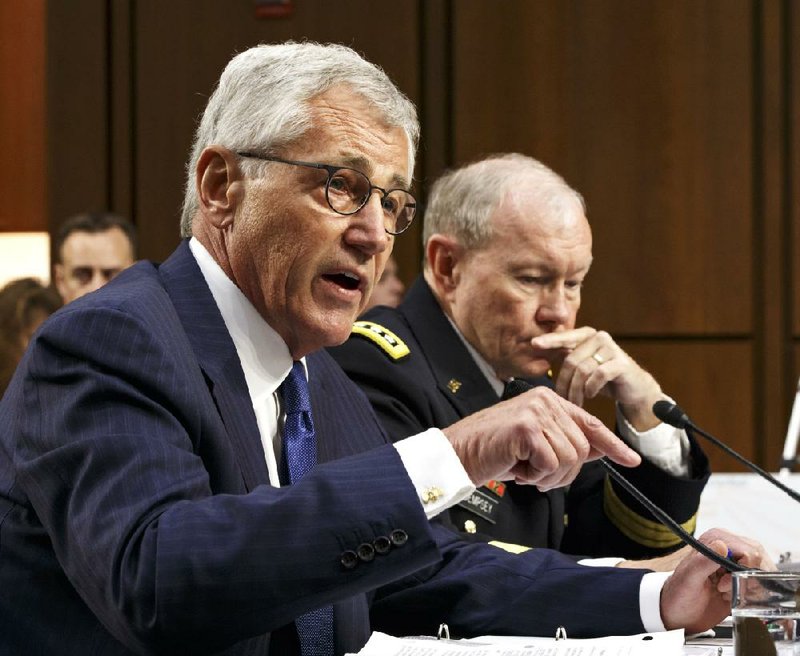 Defense Secretary Chuck Hagel (left) and Gen. Martin Dempsey, chairman of the Joint Chiefs of Staff, brief senators Tuesday on White House plans for taking on the Islamic State.