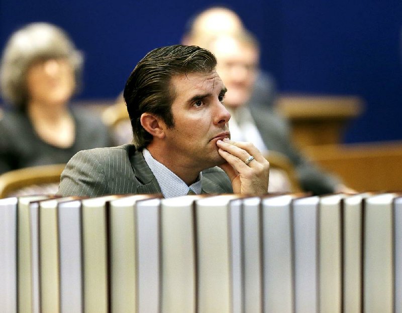 Democrat Chad Taylor on Tuesday listens to arguments before the Kansas Supreme Court in his petition to remove his name from the ballot after he withdrew from the U.S. Senate race, in Topeka, Kan.