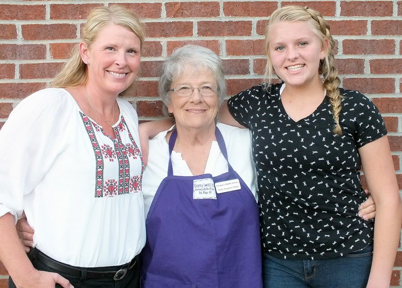 Staff photo Annette Beard Lindsey Crowder pauses with her mother, Lisa Crowder, and maternal grandmother, Mary Margeret Webb. Lindsey&#8217;s illness and time spent at Arkansas Children&#8217;s Hospital gave rise to a quilt project called Granny&#8217;s Quilts of Love.