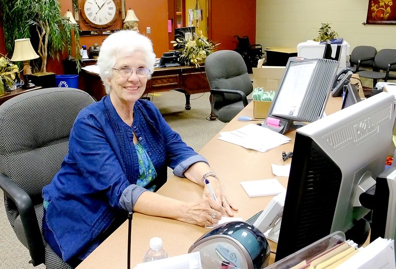 Lynn Atkins/The Weekly Vista Janet Smith volunteers one day a week in the office at Cooper Elementary School where she answers the phone and greets visitors, which gives the staff a chance to concentrate on paperwork.