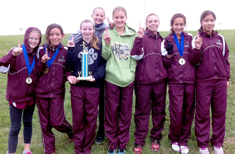 Photo submitted The Siloam Springs seventh and eighth grade girls finished first overall in their division Saturday at the Springdale Central Warrior Invitational.