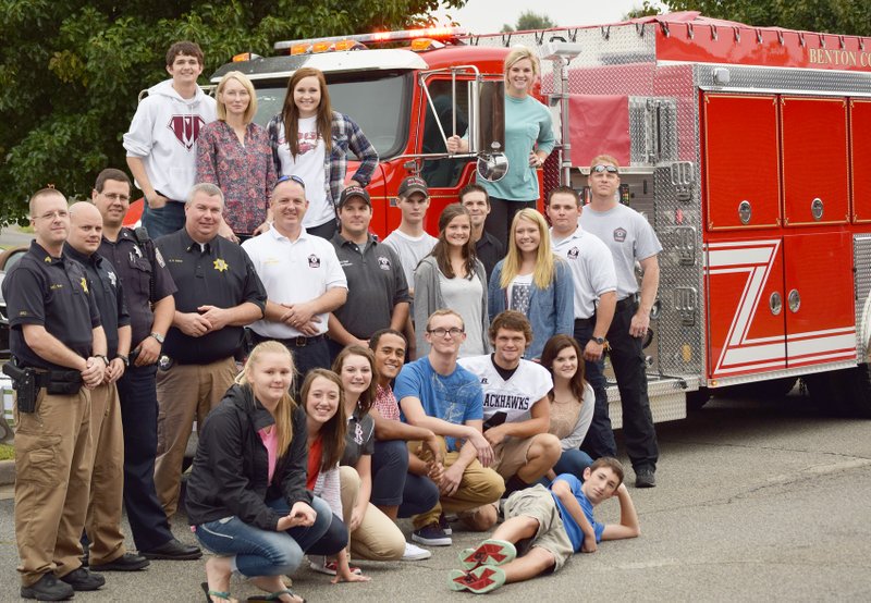 Photograph courtesy of PRHS yearbook staff Pea Ridge police and firefighters were honored with a reception on Thursday, Sept. 11, sponsored by the Pea Ridge High School Student Council. Members of the two departments were presented with thank you cards from the student body, and then shared doughnuts and juice with Student Council members. Officers from both departments shared where they were on Sept. 11, 2001, and talked about what it really means to &#8220;run in while others are running out.&#8221; It was a great time of fellowship for students and officers, alike. Student Council members, once again, say &#8220;Thank you&#8221; to the officers who protect us, each and every day.