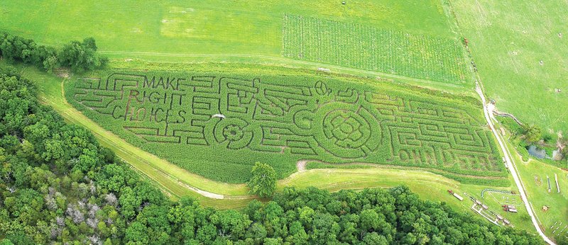 Submitted Photo This year&#8217;s corn maze features a John Deere tractor to illustrate that success in life takes hard work.