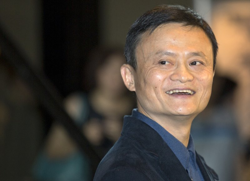 In this Monday, Sept. 15, 2014, file photo, Alibaba Group founder and Executive Chairman Jack Ma smiles before an IPO road show at a hotel in Hong Kong. Potential investors have swarmed to Alibabas presentations in advance of the initial offering. Demand has grown so feverish that Alibaba on Monday said it planned to raise the offering price from the $60 to $66 a share it had earlier set to $66 to $68.