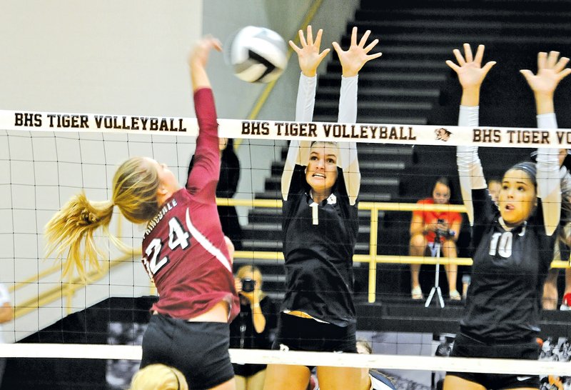  Staff Photo J.T. Wampler Bethany Maddox of Springdale High tries to get the ball past Bentonville&#8217;s Emma Palasak, center, and Lauren Bareis on Tuesday at Bentonville.