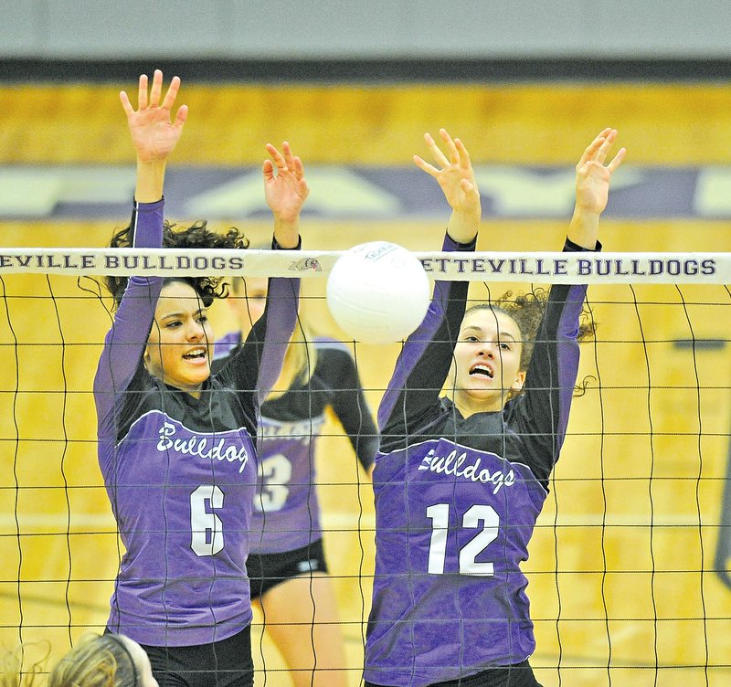  Staff Photo Michael Woods &#8226; @NWAMICHAELW Haley Warner, left, and Faith Waitsman of Fayetteville go up for a block during Tuesday&#8217;s game against Rogers at Fayetteville.