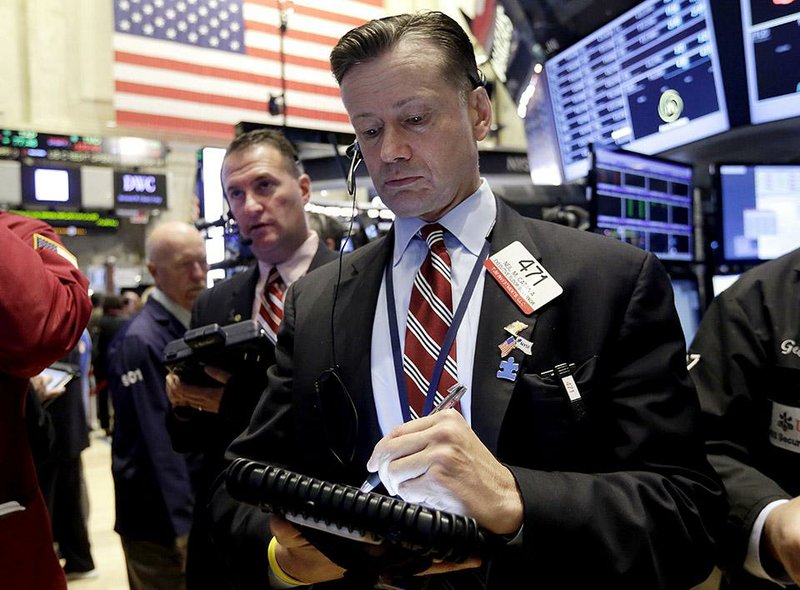 Trader Neil Catania works Wednesday on the floor of the New York Exchange.
