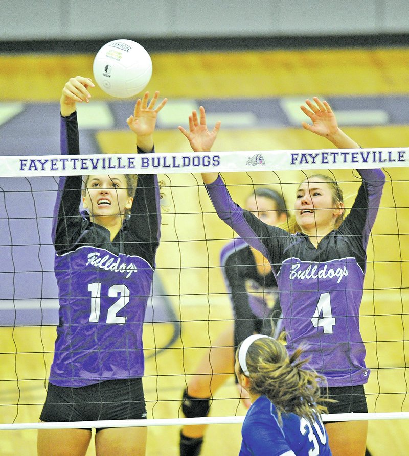  Staff Photo Michael Woods &#8226; @NWAMICHAELW Faith Waitsman, left, and Hadley Spresser of Fayetteville go up for a block during Tuesday&#8217;s game against Rogers High in Fayetteville.