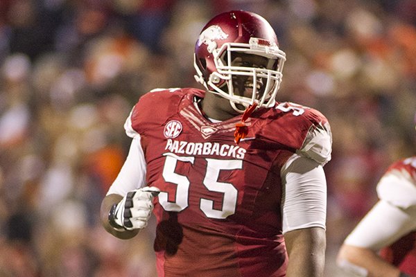 In this file photo taken Nov. 2, 2013, Arkansas offensive guard Denver Kirkland (55) reacts to a play during an NCAA college football game against Auburn in Fayetteville. (AP Photo/Beth Hall, File)