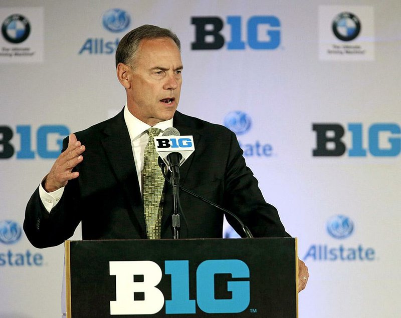 FILE - In this July 24, 2013, file photo, Michigan State head football coach Mark Dantonio listens to a question during a news conference at the Big Ten football media day in Chicago. Judgment day for the Big Ten. That might sound ominous, but the conference has a chance Saturday, Sept. 6,  to make a statement with three marquee out-of-league games that could resonate with the College Football Playoff selection committee come December. No. 7 Michigan State faces the stiffest test. The defending Big Ten champions play at No. 3 Oregon, a game that even Commissioner Jim Delany acknowledged has potential to be "disproportionately important" for the perception of the conference. (AP Photo/M. Spencer Green, File)