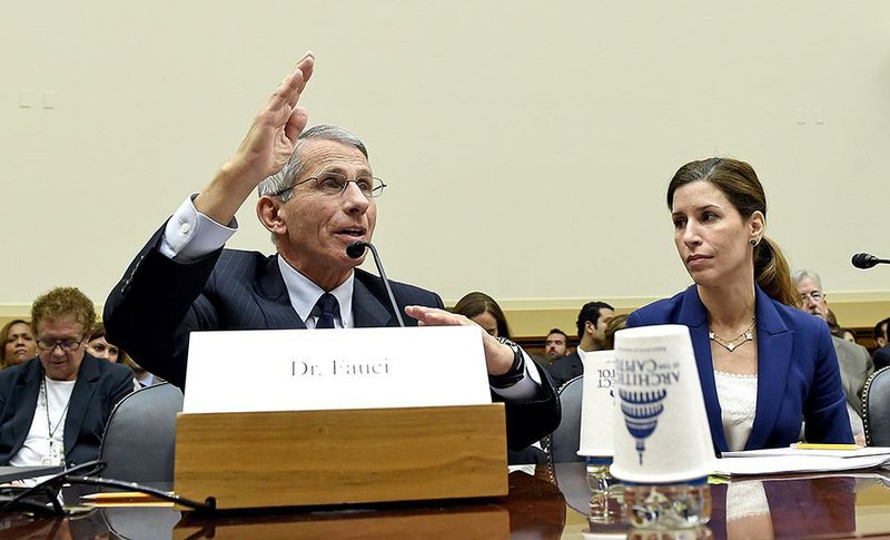 Dr. Anthony Fauci (left), the director of the National Institute of Allergy and Infectious Diseases, testifies before the House Foreign Affairs subcommittee on Africa, Global Health, Global Human Rights, and International Organizations hearing Wednesday on the Ebola virus on Capitol Hill in Washington.