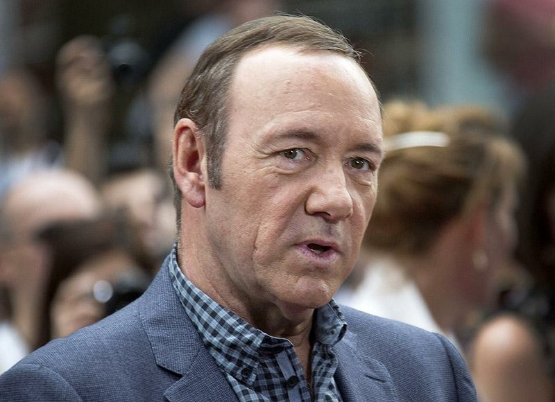 FILE - In a Monday, June 9, 2014 file photo, U.S. actor Kevin Spacey arrives for the European Premiere of Now, at a cinema in central London. A Massachusetts woman, Linda Louise Culkin of Quincy, Mass., who threatened to blow up, torture and castrate Spacey in what prosecutors called a “persistent and malevolent” cyberstalking campaign, was sentenced Wednesday, Sept. 17, 2014, to more than four years in prison. A federal judge in Boston also ordered Culkin to pay Spacey $124,000 in restitution for bodyguards.The 55-year-old Culkin has been jailed since January 2012, meaning she has about 18 months left to serve. She pleaded guilty in November to charges including mailing threatening communications, and sending false information regarding explosives. (Photo by Joel Ryan/Invision/AP, File)