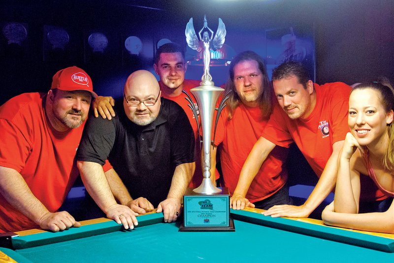 From left, Ronnie Nelson, Darren Gambill, Nathan Crow, Mike Cordell, Dave Violette and Courtney Hutchinson were part of the You Got Action pool team from Jacksonville. The team won the American Poolplayers Association’s national tournament.
