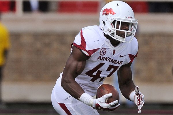 Arkansas linebacker Martrell Spaight runs back an interception in the second quarter of a game against Texas Tech at Jones AT&T Stadium in Lubbock, Texas on Saturday, Sept. 13, 2014. 