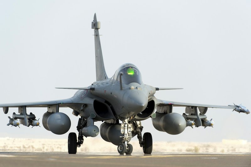 This photo provided Friday, Sept.19, 2014 by the French Army's video and photo department ECPAD shows a Rafale jet fighter landing in Al Dhafra base, UAE, after a strike in Iraq Friday. Joining U.S. forces acting in Iraqi skies, France conducted its first airstrikes Friday against the militant Islamic State group, destroying a logistics depot that it controlled, Iraqi and French officials said. Rafale fighter jets accompanied by support planes struck the depot in northern Iraq on Friday morning, and the depot, which helped the extremist group launch operations, was “entirely destroyed,” President Francois Hollande said. This Rafale jet did not drop its amunition. 